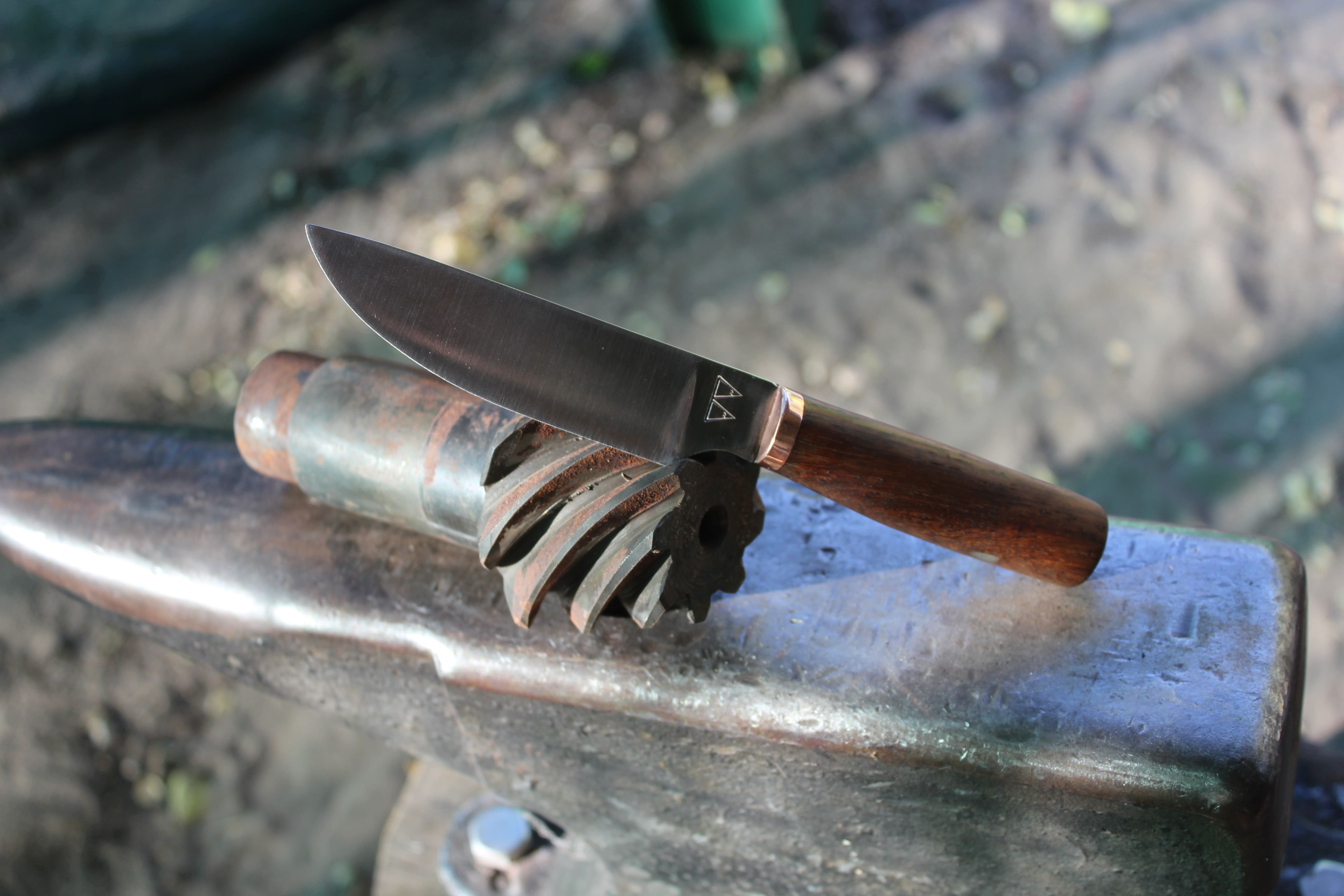 A custom skinning knife with a Mukwa handle and copper bolster. A custom skinning knife with a Mukwa handle and copper bolster.