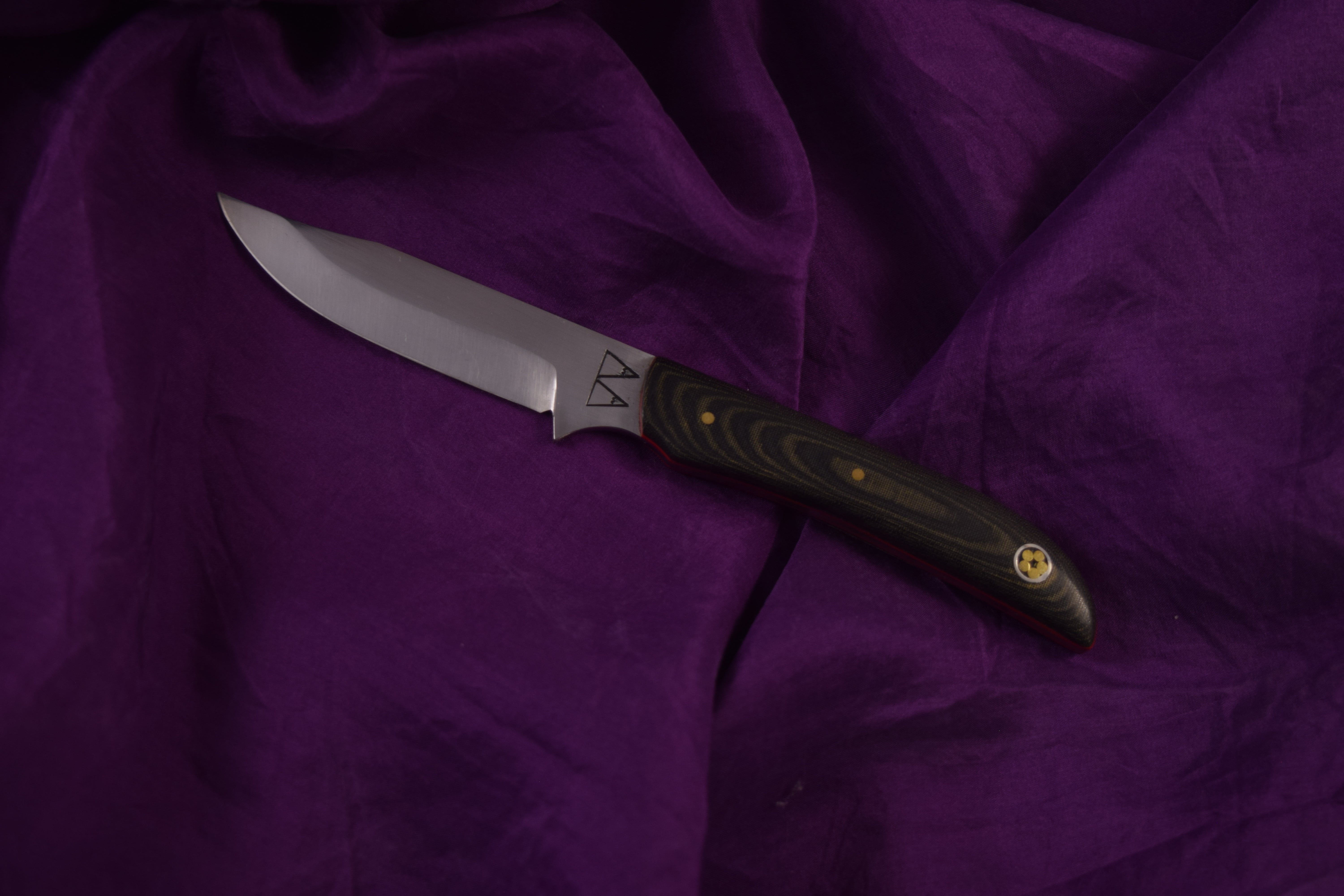 A Jackal with a Micarta handle. A Jackal with a Micarta handle.