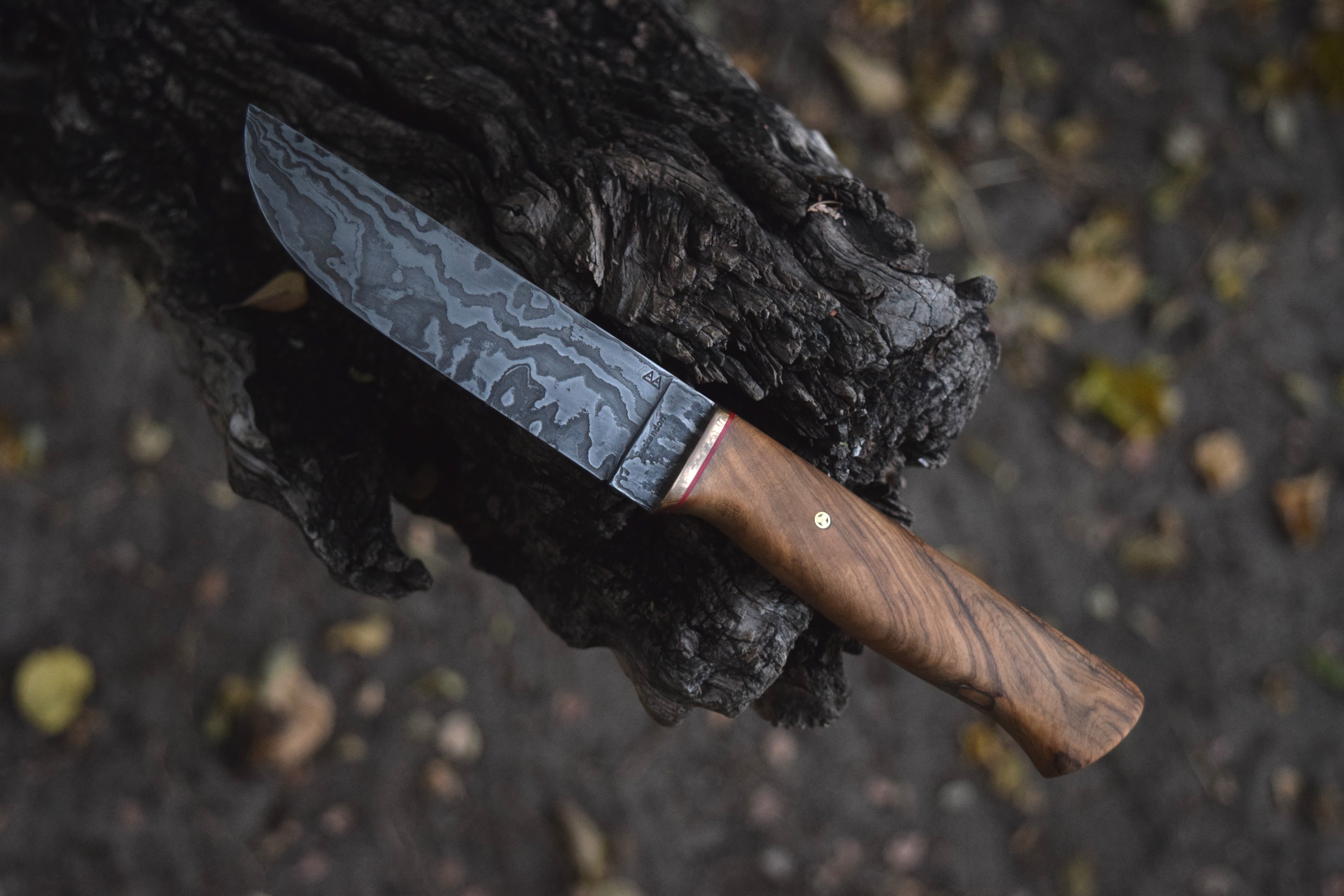 An 80-layer damascus Bushbuck with an Olivewood handle An 80-layer damascus Bushbuck with an Olivewood handle